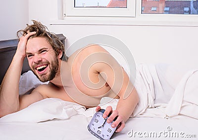 Enough sleep for him. Regulate your bodys clock. Man unshaven tousled hair wakeful face having rest. Good morning. Man Stock Photo