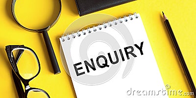 ENQUIRY word written on notepad. ENQUIRY text on table for your desing Stock Photo