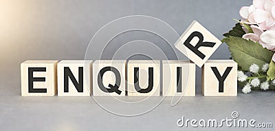 ENQUIRY word written on wood block. ENQUIRY text on table for Stock Photo
