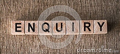 ENQUIRY word written on wooden blocks on a brown background Stock Photo