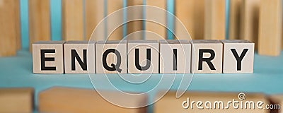 ENQUIRY word written on wooden blocks over light blue background Stock Photo