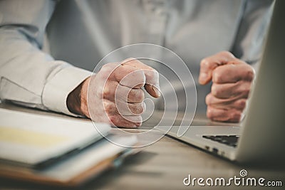 Enraged businessman in office Stock Photo