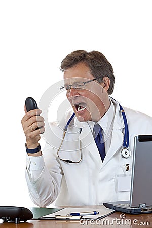 Enraged chief doctor screams loud into phone Stock Photo