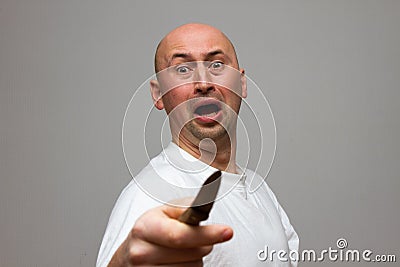 Enraged man with knife Stock Photo