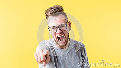 Enraged man screaming pointing mouth open anger Stock Photo