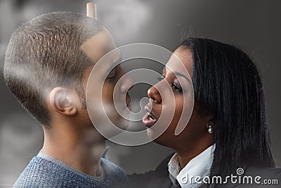 Disrespectful act, woman pretends bite, man abstains Stock Photo