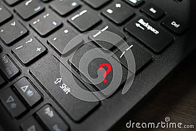 Enter button on laptop keyboard with question mark. Enter keyboard key button on a computer. Close up of Enter key of Laptop compu Stock Photo