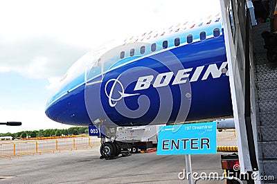 Enter dream tour signage beside Boeing 787 Dreamliner at Singapore Airshow 2012 Editorial Stock Photo