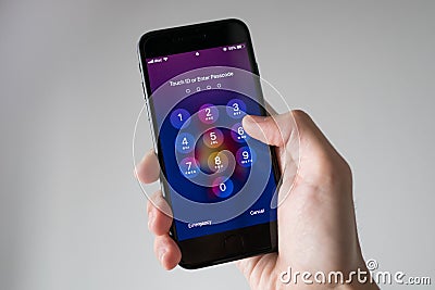 Entering the iPhone 7 Passcode Editorial Stock Photo
