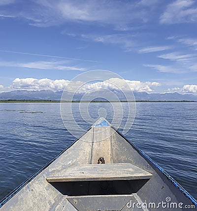 Entering Skadar lake on a wooden boat Stock Photo