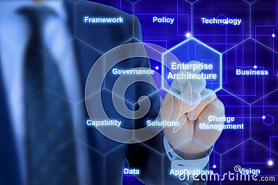 Enterprise architect pressing a tile in a hexagon grid Stock Photo