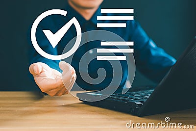Enterprise performance checklist. Men use computers to do online checklist surveys and fill in digital checklists Stock Photo