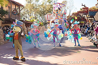 Entertainers in colorful costumes participating in DisneyWorld parade Editorial Stock Photo