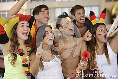 Enthusiastic German sport soccer fans celebrating victory. Stock Photo