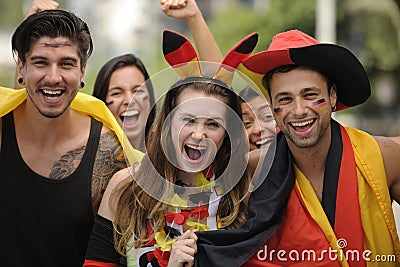 Enthusiastic German sport soccer fans celebrating victory. Stock Photo