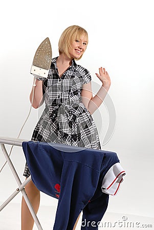 Enthusiastic housewife ironing Stock Photo