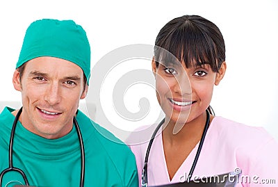 Enthusiastic medical team looking at X-ray against Stock Photo