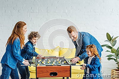 Enthusiastic redhead family playing Stock Photo