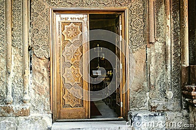 Entrance church wooden door with carved elements folk ornament Stock Photo