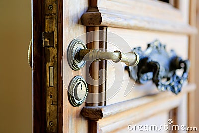 Entrance door handle with keyhole. Close up view Stock Photo