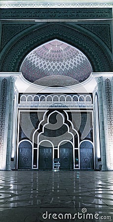 Entrance door of the mosque with arrow pointer Stock Photo