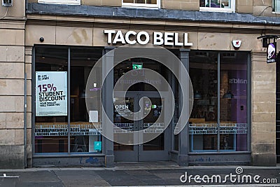 Entrance facade to Taco Bell cafe restaurant in high street location with sign branding and logo Editorial Stock Photo