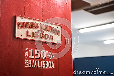 Entrance of fire station Bombeiros VoluntÃ¡rios de Lisboa. Detail of red sign of Editorial Stock Photo