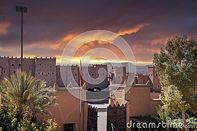 Entrance of fortified castle building against cloudy sky Stock Photo
