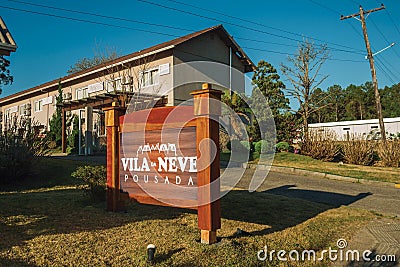 Entrance with garden and guesthouse signboard Editorial Stock Photo