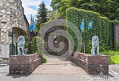 Entrance gate of the Lockheart Castle adorned with two bronze statues of lions in Japan. Editorial Stock Photo