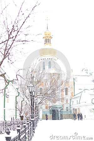 Entrance gate of the Pechersk Lavra in Kiev, Ukraine. The Gate Church of the Trinity in winter snow Stock Photo