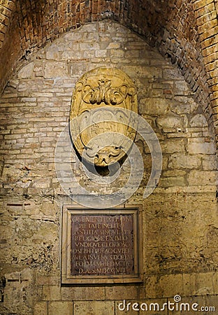 Entrance of a historic building adorned with a plaque in Perugia, Italy Editorial Stock Photo