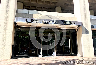 Entrance of the J. Edgar Hoover FBI building with revolving door in washington DC Editorial Stock Photo