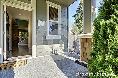 Entrance porch with opened door on a sunny day Stock Photo