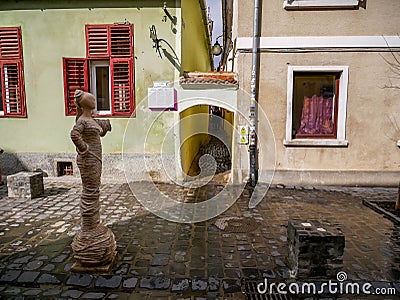 Entrance of the Rope street , one of the narrowest streets in Europe, focus on the sculpture wearing ropes. Editorial Stock Photo