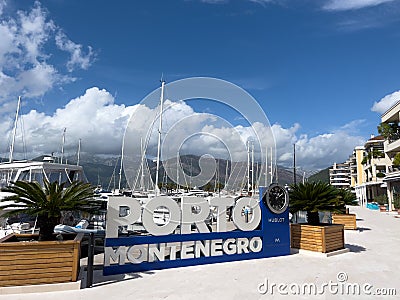 Tivat, Montenegro - 11 august 2023: Entrance sign against the background of the pier. Caption: Porto, Montenegro Editorial Stock Photo