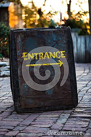 Entrance sign made out of rusty metal sheet Stock Photo