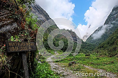 Entrance sign to a mysterious valley Stock Photo