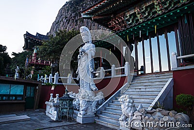 Entrance and Statua at Sanbanggulsa temple after sunset, Sanbang-ro, Jeju Island, South Korea Stock Photo