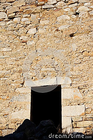 The entrance of a stone tower at the medieval village of Vathia in southeastern Laconia Stock Photo