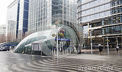 Entrance to Canary Wharf Underground station in London city, United Kingdom. Big Ben in background Editorial Stock Photo