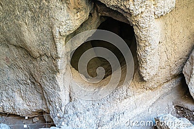 Entrance to a cave in the mountains of Armenia, close-up. Stock Photo