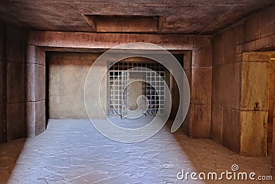 The entrance to the dark dungeon with walls of large concrete blocks and a ceiling of monolithic reinforced concrete, made in the Stock Photo