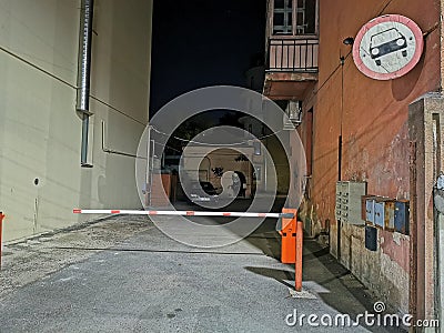 Entrance to an enclosed yard with a bump and a forbidden traffic sign Editorial Stock Photo