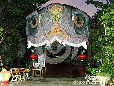 Entrance to an exhibition hall shaped like a turtle`s head at Wat Sam Phran Temple Editorial Stock Photo
