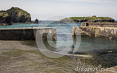 Entrance to harbour at Mullion Cove in Cornwall in England Stock Photo