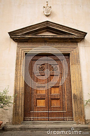 Entrance to a historic building with large heavy timber doors Editorial Stock Photo