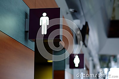 Entrance to the male and female toilet. Sign in airport Stock Photo