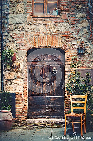 Entrance to an old house in a medieval village in Tuscany Stock Photo