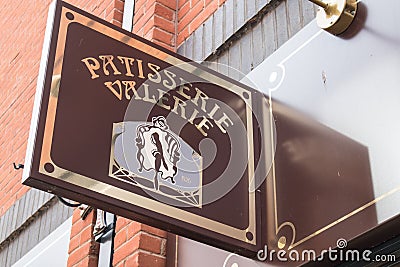 Entrance to Patisserie Valeria Cake store shop showing logo, sign, signage and branding Editorial Stock Photo